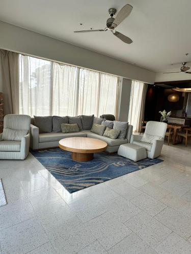 a living room with a couch and a coffee table at Villa seaview and apartment -Spa Da Nang Resort by JT group "Free pick up" in Da Nang