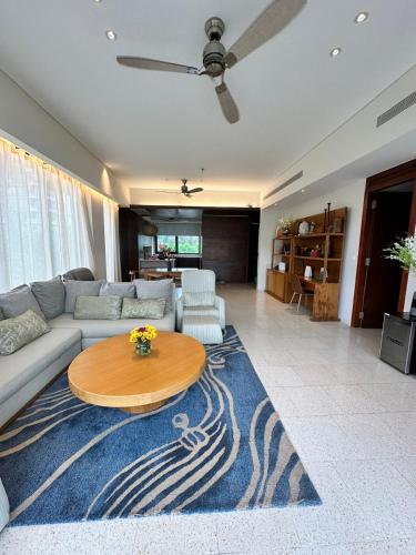 a living room with a couch and a table at Villa seaview and apartment -Spa Da Nang Resort by JT group "Free pick up" in Da Nang