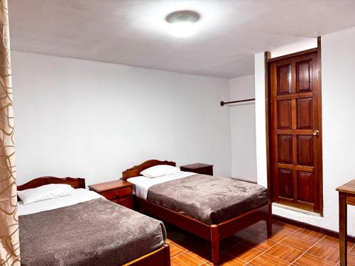 Katil atau katil-katil dalam bilik di Casa Hospedaje Grandez