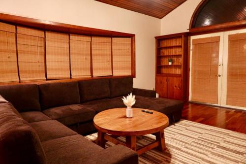 a living room with a couch and a table at Cozy & Private Retreat Near Atlantic City! in Galloway
