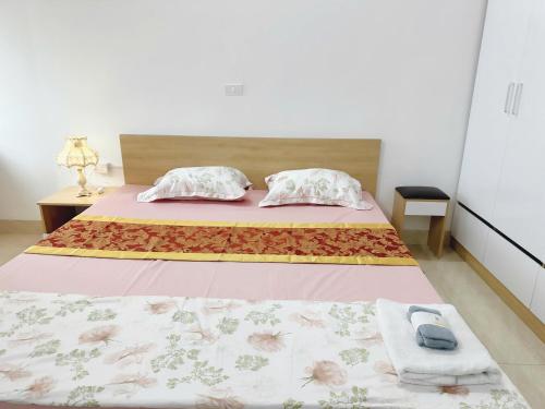 Postel nebo postele na pokoji v ubytování Chill House 702TM3