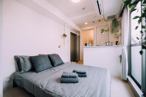 Krevet ili kreveti u jedinici u okviru objekta Minimalist Loft Namba Compact Studio with a 24-hour Gym MA1003