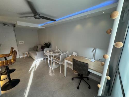 a living room with a table and a couch at Luxury Apartment Jacuzzi Air Conditioning Fireplace and King Bed in Medellín
