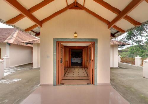 an empty hallway of a house with a corridor at Tea county in Munnar
