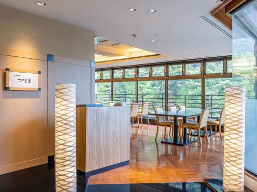 a dining room with a table and chairs at Hakoneji Kaiun in Hakone