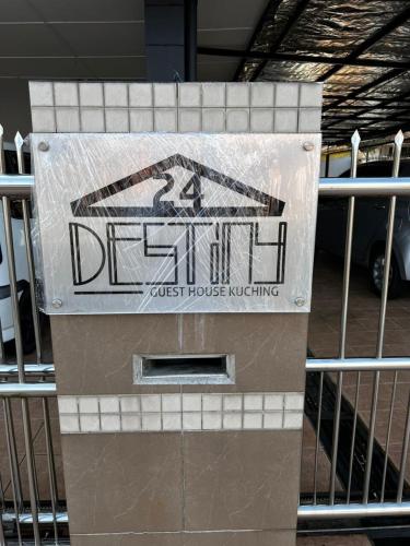 a sign that reads just house rusting next to a gate at Destiny Guesthouse Kuching Near Airport 4pm checkout in Kuching