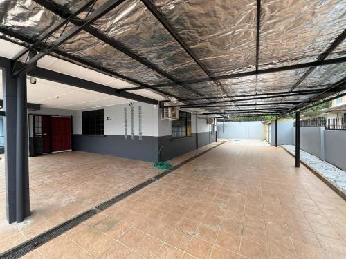 an empty building with a large room with a ceiling at Destiny Guesthouse Kuching Near Airport 4pm checkout in Kuching