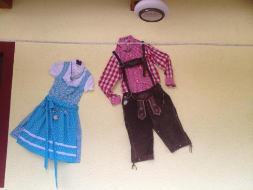 three pieces of clothing hanging on a wall at Landhaus Aubauerngut in Radstadt