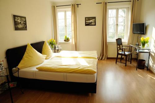 En eller flere senge i et værelse på Klosterschänke Hude Hotel Ferienwohnungen Restaurant Café