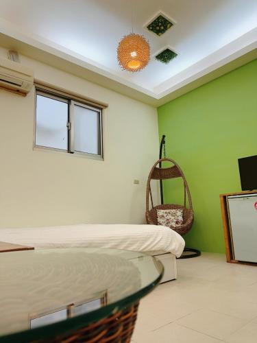 a room with two beds and a tv and a mirror at 17 Happiness in Xiaoliuqiu