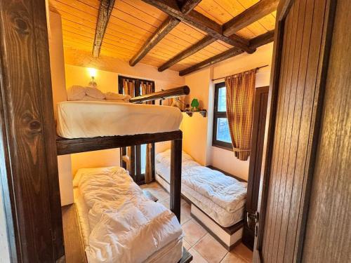 a room with two bunk beds in it at Paragon of Arachova in Arachova
