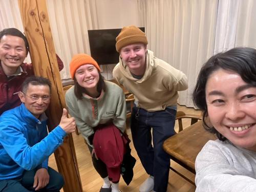 a group of people posing for a picture at TESHIKAGA HOSTEL MISATO in Teshikaga
