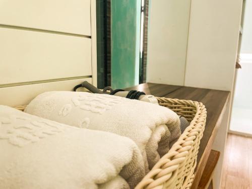 two baskets of towels on a shelf in a room at 初嶼Meet in Hengchun
