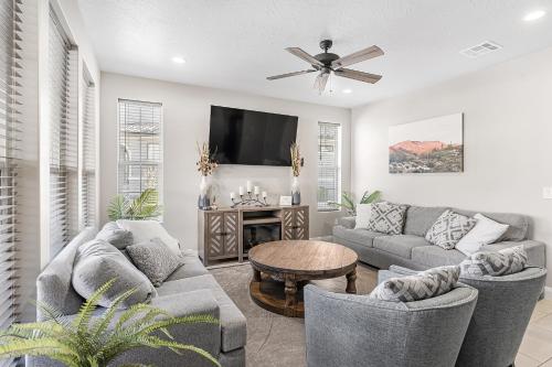 a living room with two couches and a tv at Escondido Cove in Washington