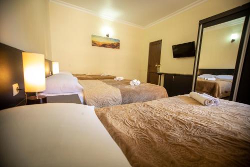 Postel nebo postele na pokoji v ubytování Hotel Chveni Ezo