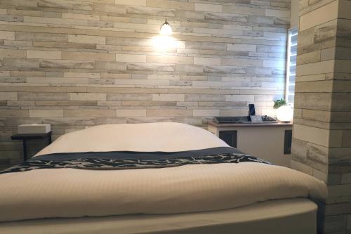 Postel nebo postele na pokoji v ubytování Spa & HOTEL La fontaine