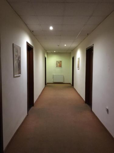 an empty hallway in an office building at Hotel Ferihegy in Vecsés