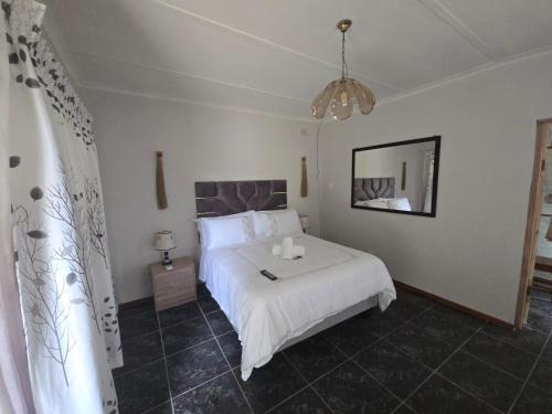 Ένα ή περισσότερα κρεβάτια σε δωμάτιο στο River Heaven BnB