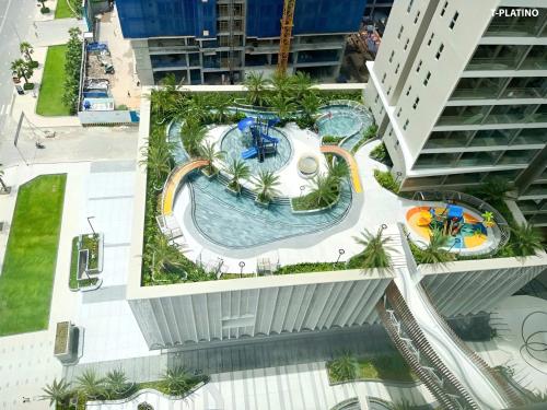 an overhead view of a swimming pool on a building at T-Plantino - Căn hộ Codotel The Sóng 5 Sao - Free swimmingpool, Gym, Sauna in Vung Tau
