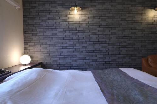 Postel nebo postele na pokoji v ubytování Spa & HOTEL La fontaine