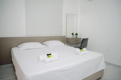 Ένα ή περισσότερα κρεβάτια σε δωμάτιο στο Nissi Route 76