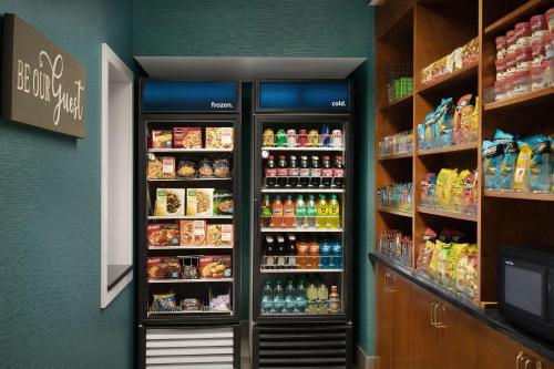 a refrigerator in a store with food and drinks at Hampton Inn and Suites Lynchburg in Lynchburg