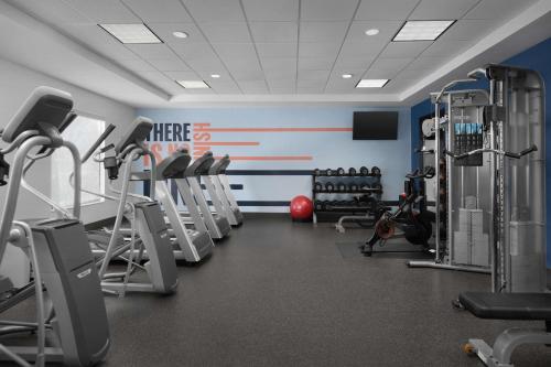 a gym with several tread machines in a room at Hampton Inn and Suites Lynchburg in Lynchburg