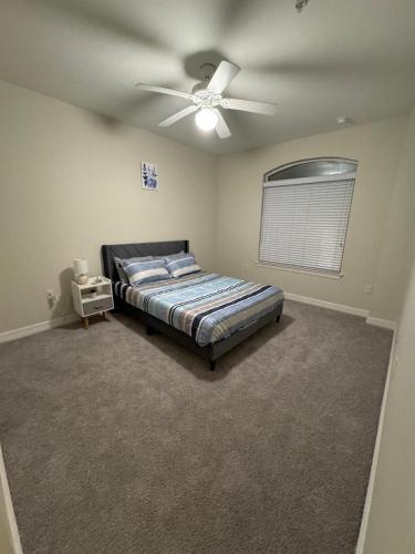 a bedroom with a bed and a ceiling fan at Stylish 1BHK, 1 Bath in Cedar Park, Austin, TX in Cedar Park