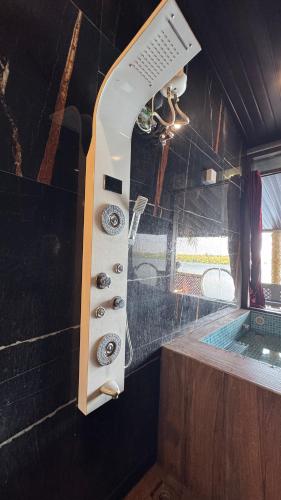 a bathroom with a sink and a bath tub at Vistara Beach Resort Malpe - Udupi in Udiyāvara