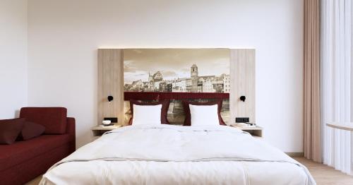 Ένα ή περισσότερα κρεβάτια σε δωμάτιο στο Das Wasserburg Hotel