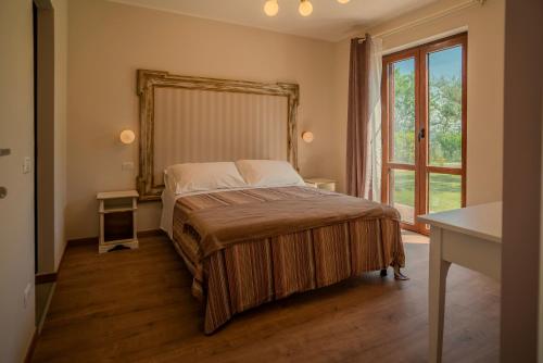Postel nebo postele na pokoji v ubytování Agriturismo Violati