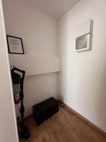 a corner of a room with a white wall with a heater at GuestReady - Amazing Studio near Disneyland in Montévrain
