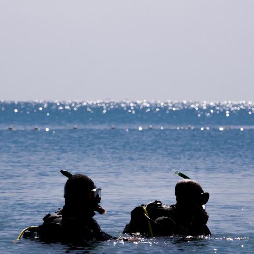 two people in the water in the ocean at Serry Beach Resort in Hurghada