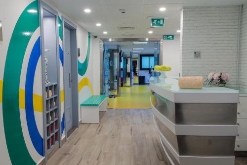 a corridor of a hospital with a waiting room at Raouche Arjaan by Rotana in Beirut