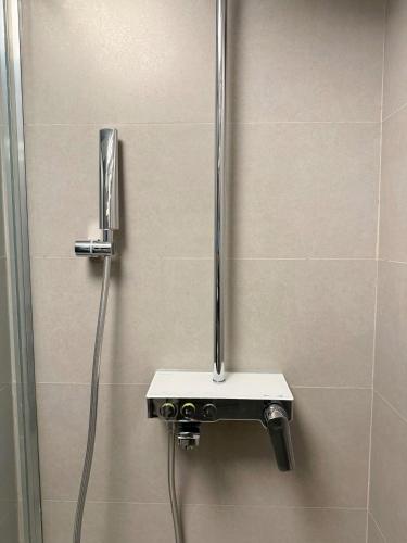 a shower in a bathroom with a shower at The Yalı Konak Hotel İzmir in Izmir