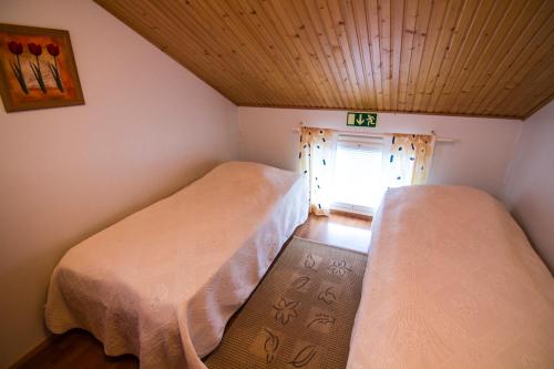 Postel nebo postele na pokoji v ubytování Vuokatti Apartments