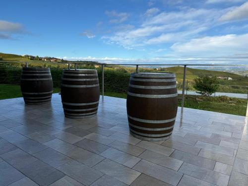 a group of barrels sitting on top of a patio at Country House Villa Barbero in Mango
