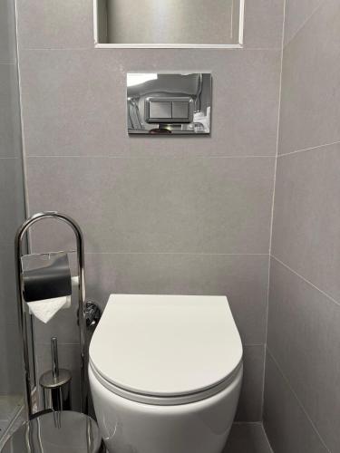 a bathroom with a white toilet in a room at The Yalı Konak Hotel İzmir in Izmir