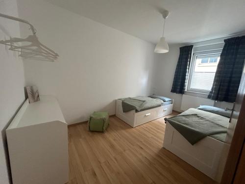 Un ou plusieurs lits dans un hébergement de l'établissement Ferienwohnung in der Mitte von Eisenach
