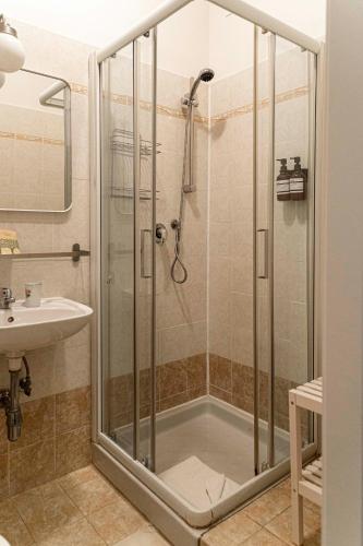 a bathroom with a shower and a sink at Affittacamere Zanobi 45 in Florence