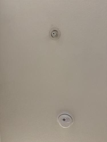 two lights on the ceiling of a room at Cedar Park, Austin Cozy Retreat in Cedar Park
