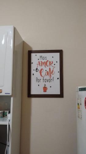 a picture on a wall with a sign on it at Smart Flat Rio in Rio de Janeiro