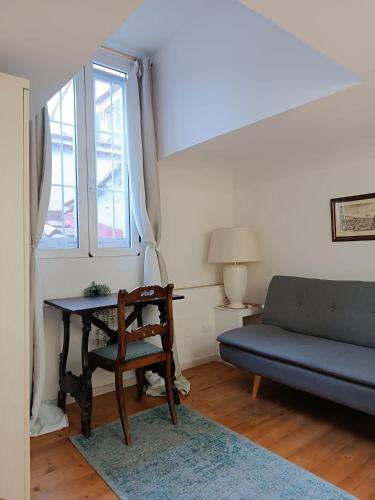 a living room with a table and a couch at Affittacamere Zanobi 45 in Florence
