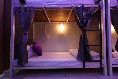 a couple of bunk beds in a room at Perfectstayz Value Forest Valley Rishikesh in Rishīkesh