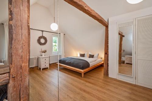 a bedroom with a bed and a mirror at Große Use in Benz