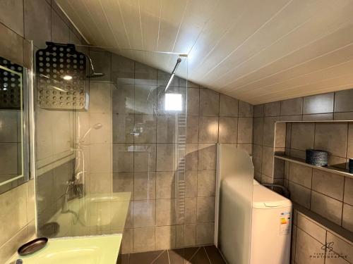 a bathroom with a shower and a toilet and a sink at Le Bel Vu - Sea view in Le Barcarès