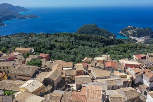 an aerial view of a village with the ocean at VitouHouse Lakones in Lákones