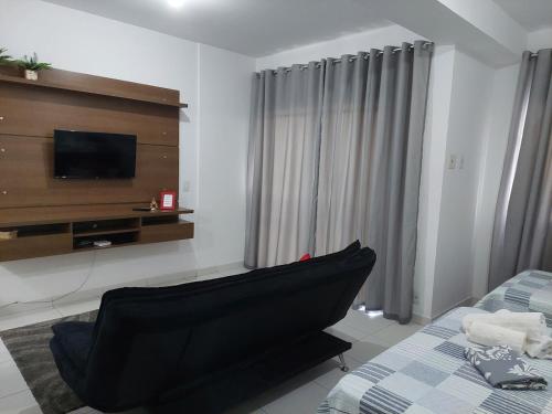 En eller flere senge i et værelse på Flat em Itaguaí