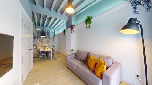 a living room with a couch and a table at Myflats Old Corner in Alicante