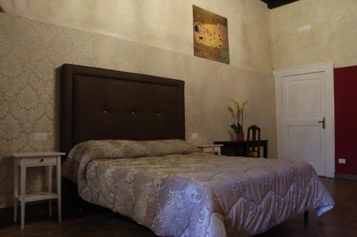 Katil atau katil-katil dalam bilik di B&B Suite Palazzo Luciani
